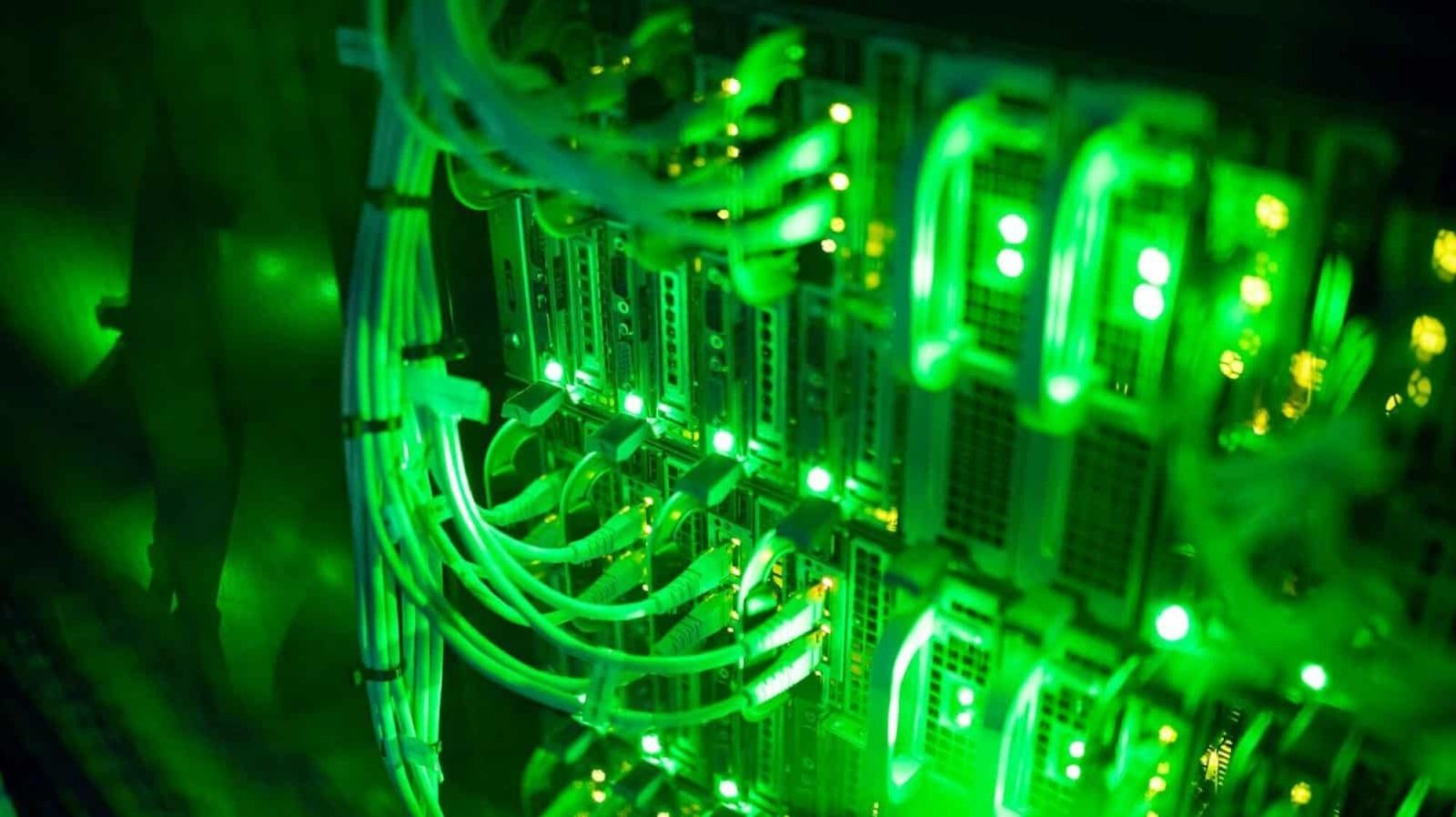 Closeup of computer server with colorful lights and wires